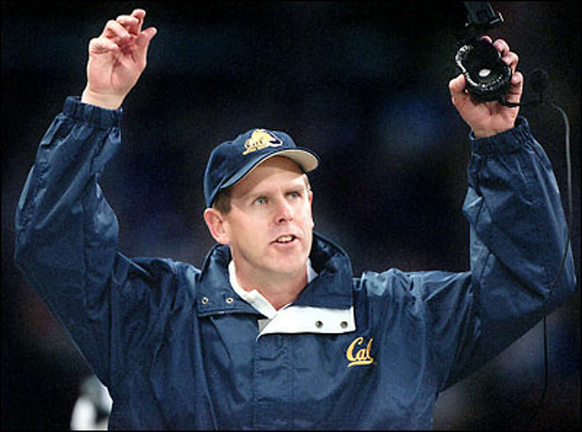Cal coach Tom Holmoe tries to get his players' attention.
