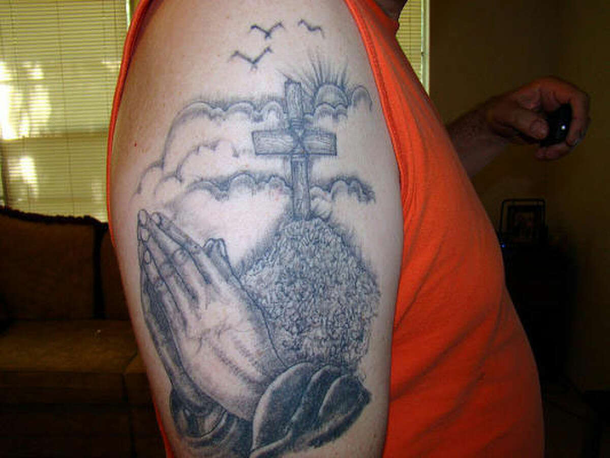 A religious scene is depicted on this man's arm. (TexasDarkHorse/Flickr Creative Commons)