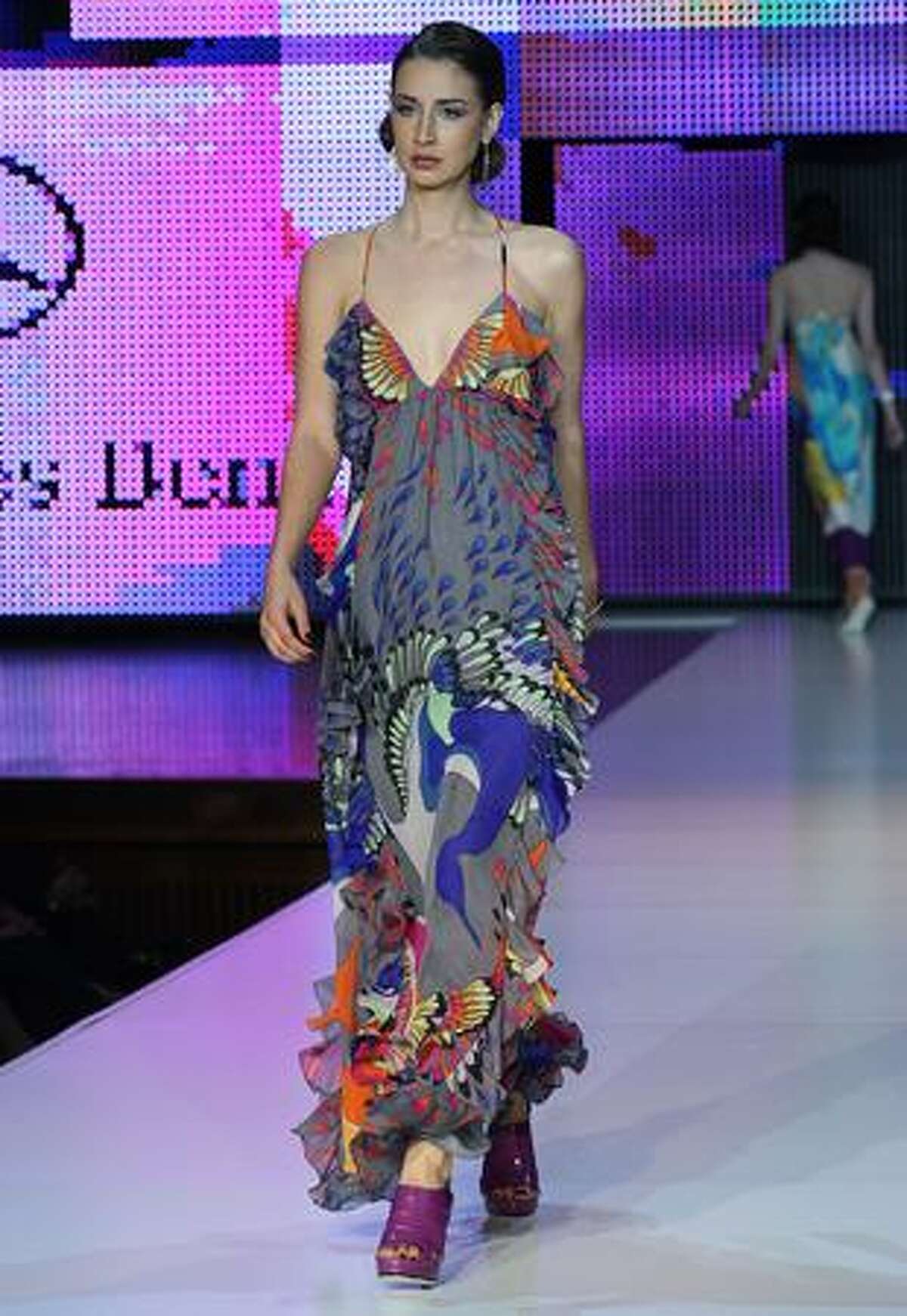 A model showcases a design by Frockshop.