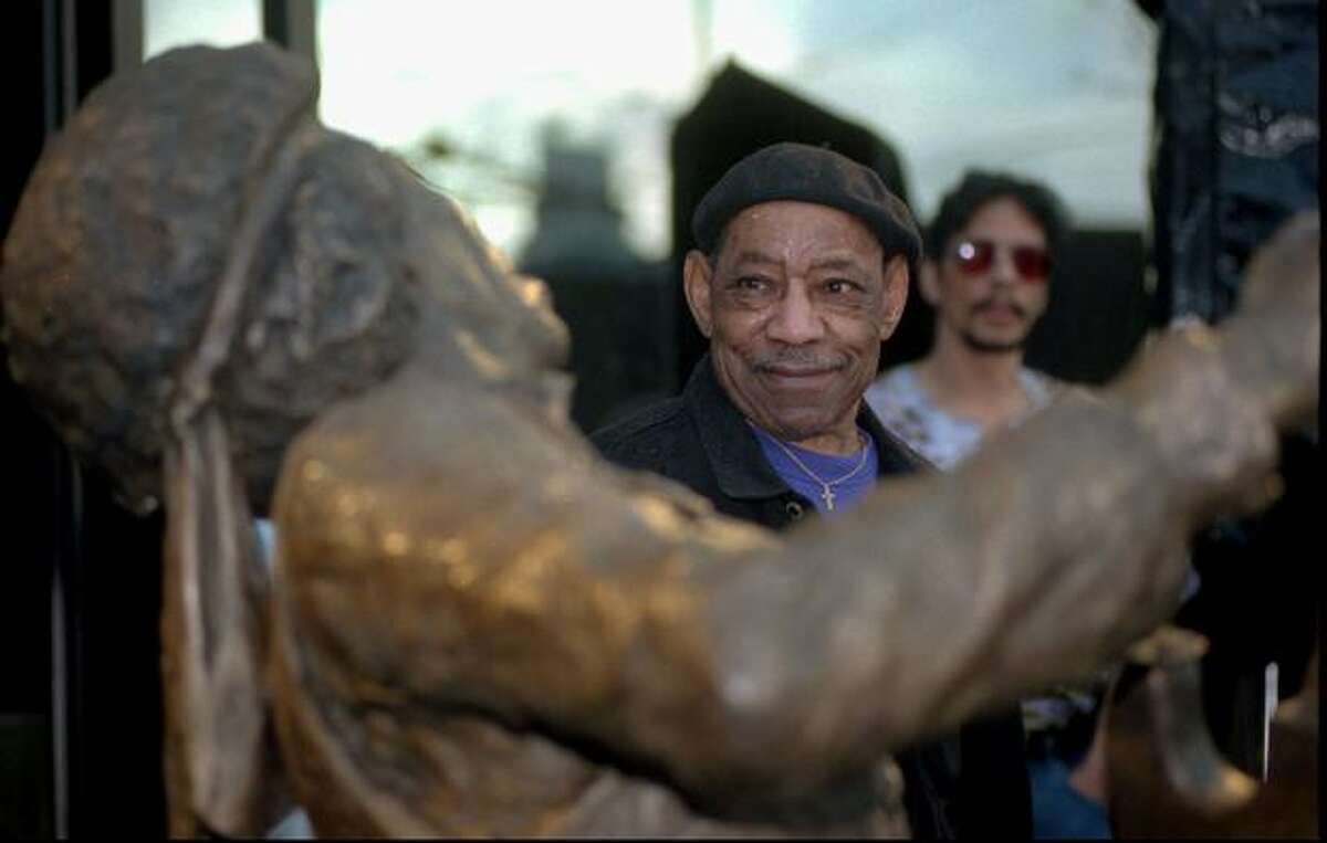 Al Hendrix, father of the late guitarist Jimi Hendrix, views a bronze statue of his son at an unveiling ceremony Tuesday, Jan. 21, 1997, outside the corporate offices of AEI Music in Seattle. AEI Music commissioned the statue to memorialize Hendrix's 1970 Fender Stratocaster guitar, which AEI owned, as part of their "Legends Collection" of music memorabilia. (AP Photo/Robert Sorbo)