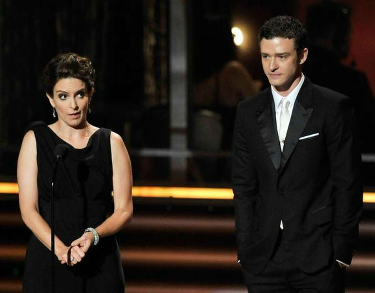 Actress Tina Fey (L) and singer Justin Timberlake speak onstage during the 61st Primetime Emmy Awards held at the Nokia Theatre on Sunday in Los Angeles, California.