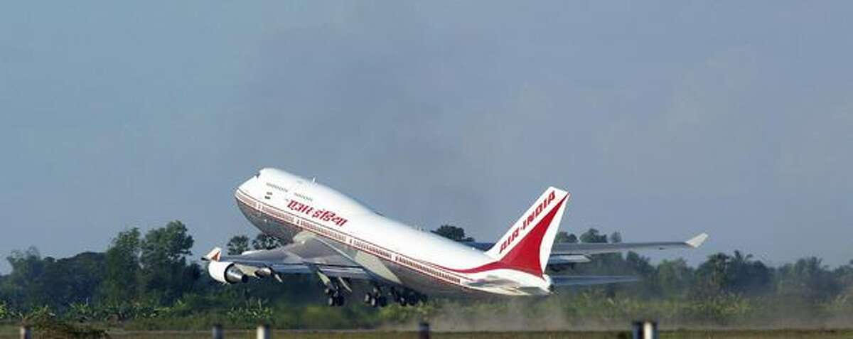 The Boeing 747 plane of Indian Prime Minister Manmohan Singh takes off in Vientiane, Laos, on November 28, 2004. (LAURENT FIEVET/AFP/Getty Images)