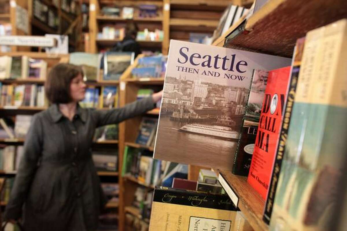 Customers browse the aisles of Elliott Bay Book Co. during the final day at the historic Pioneer Square location on Wednesday March 31, 2010 in Seattle. The legendary bookstore closed its Pioneer Square location on South Main Street Wednesday after 36 years of operation. Owners hope to open its new location at 1521 10th Ave. in Capitol Hill by April 14.