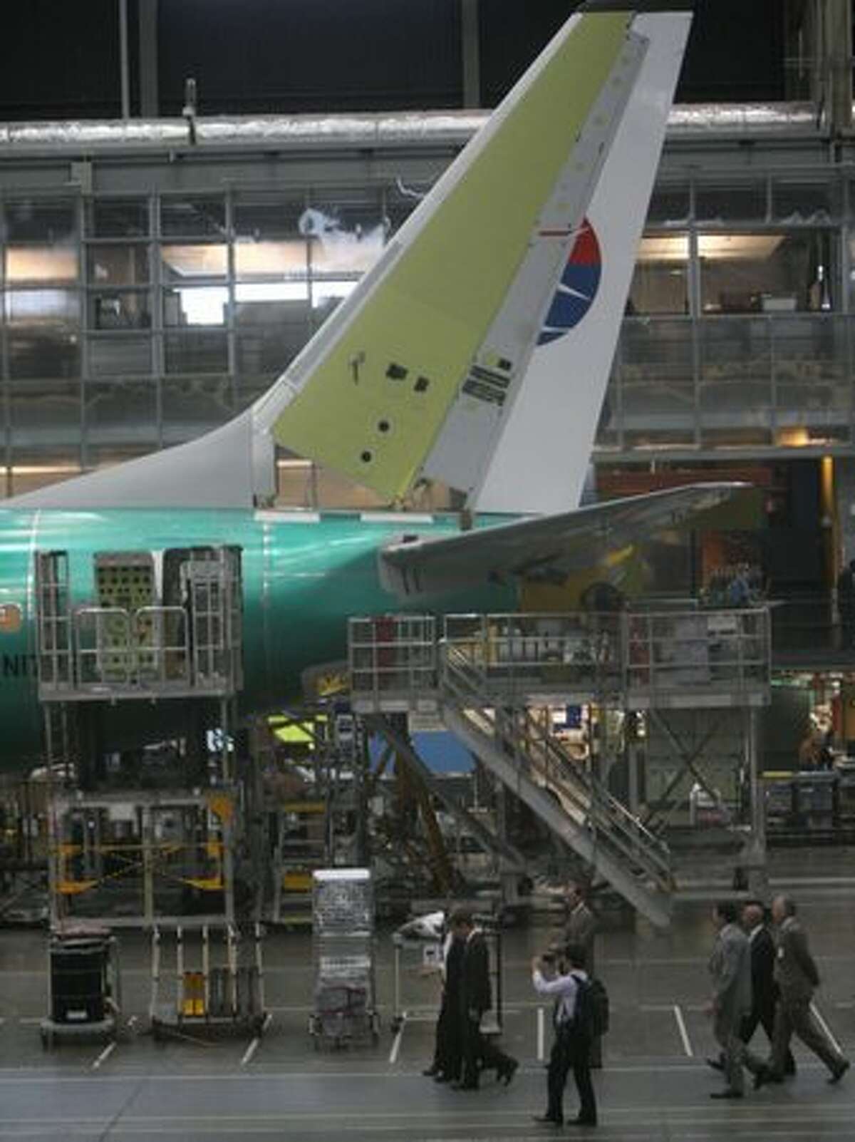 Treasury Secretary Tim Geithner tours Boeing's 737 assembly line, in Renton, Wash., with Boeing executives.