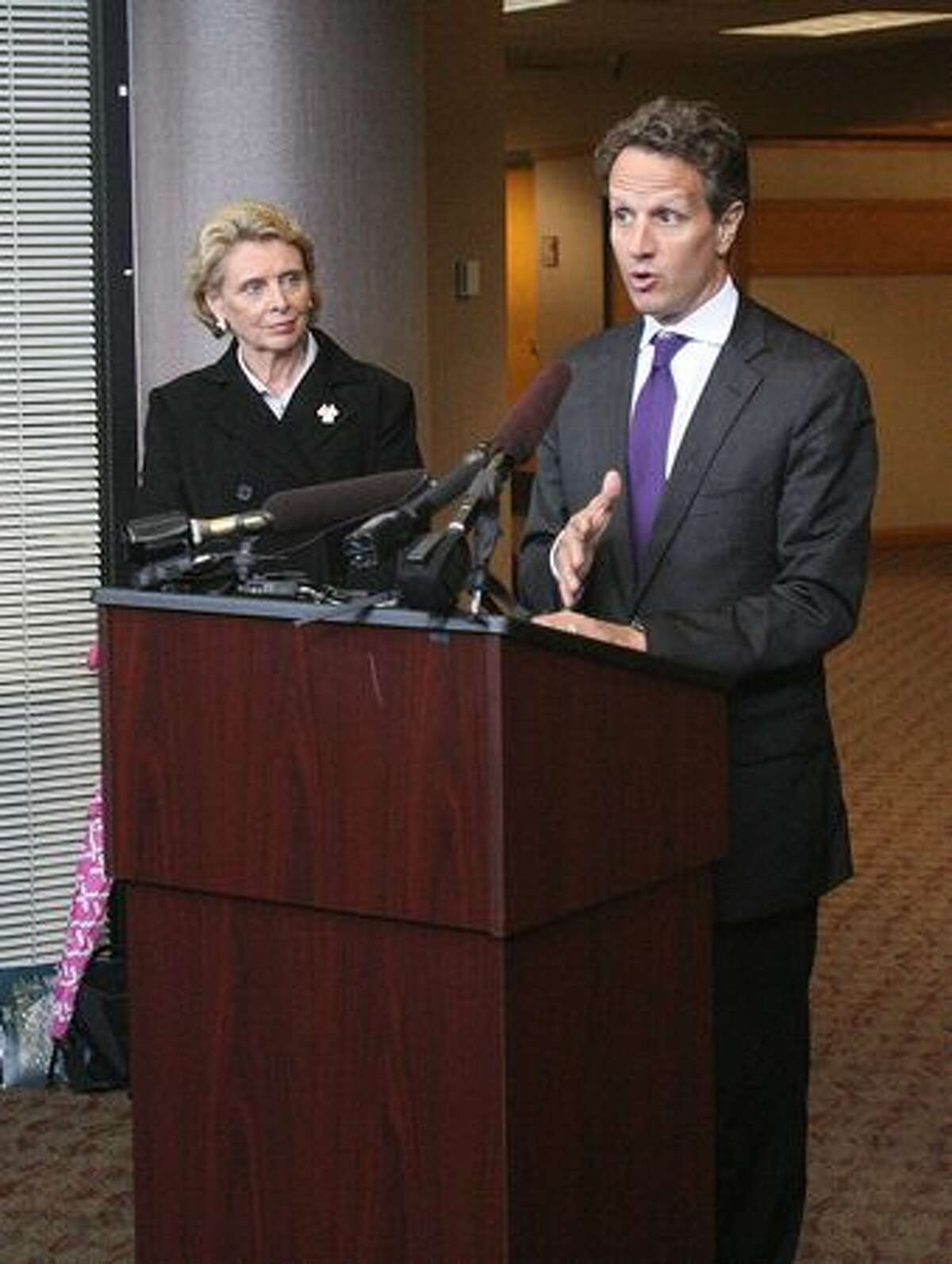 Treasury Secretary Tim Geithner talks about trade at the Port of Tacoma while Washington Gov. Chris Gregoire listens.
