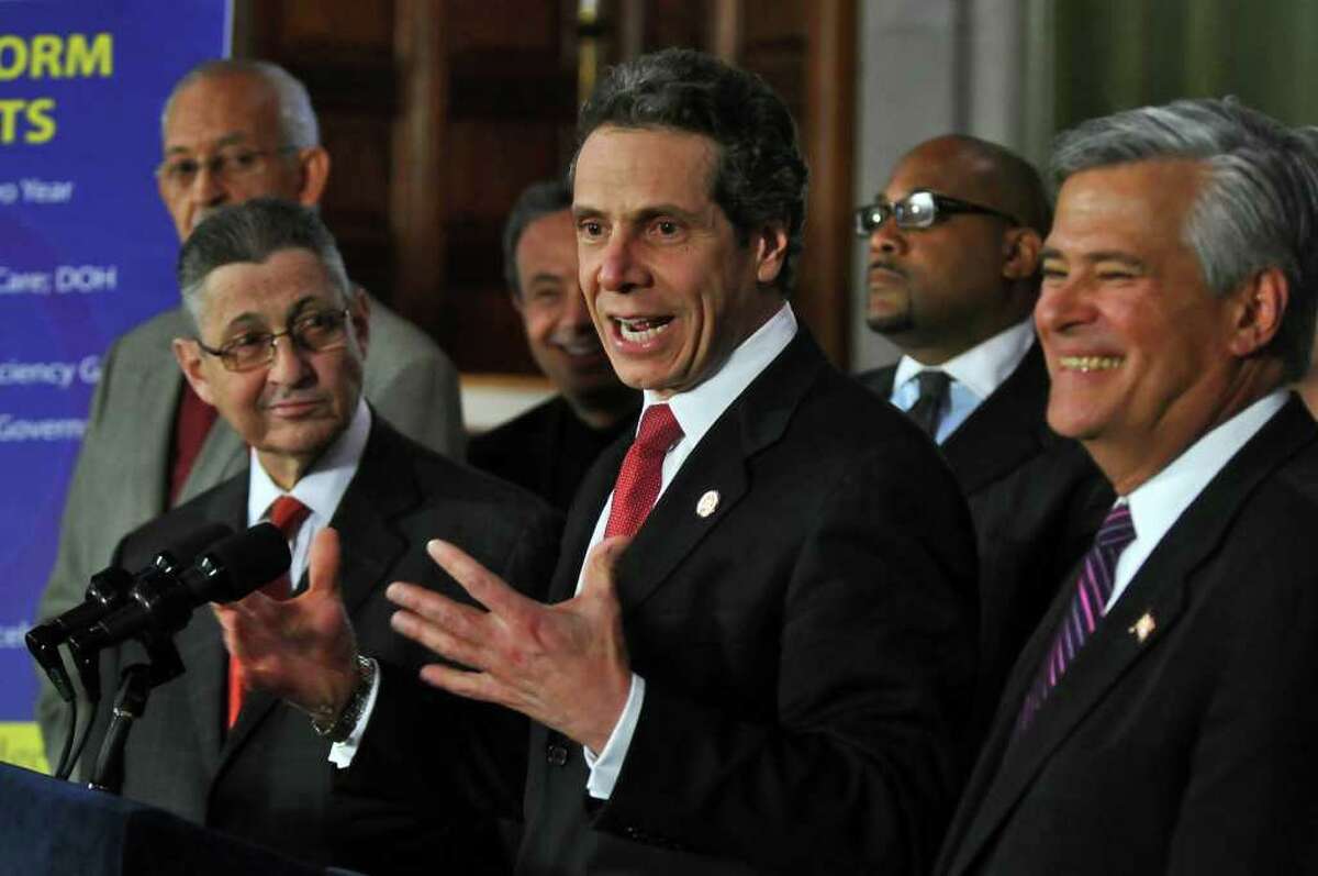 Governor Andrew Cuomo announces a budget agreement with legislative leaders including Assembly Speaker Sheldon Silver, left, and Senate Majority Leader Dean Skelos, right, in the Capitol late Sunday afternoon March 27, 2011 in Albany, NY. ( Philip Kamrass/ Times Union )
