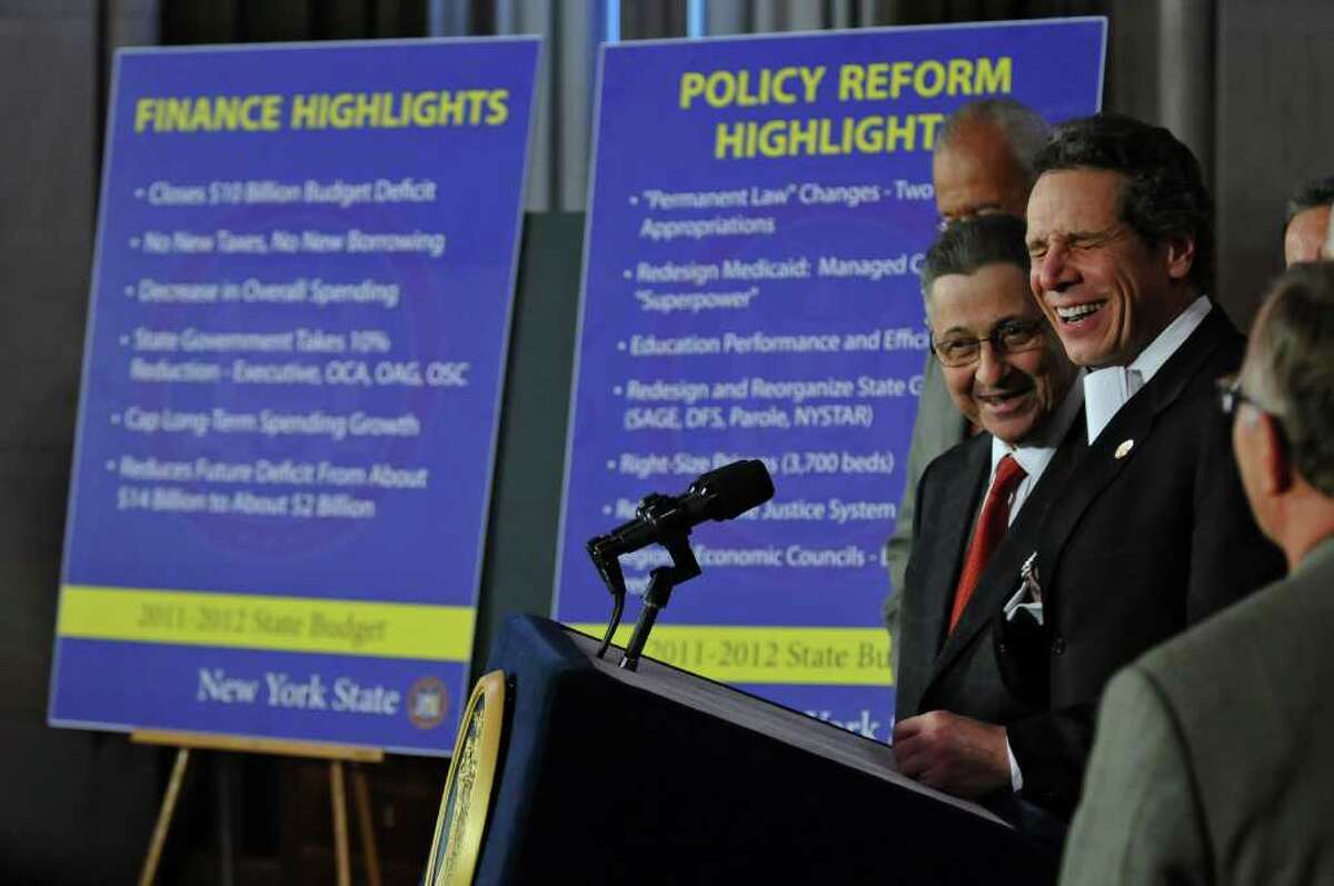 Governor Andrew Cuomo announces a budget agreement with legislative leaders including Assembly Speaker Sheldon Silver, left, in the Capitol late Sunday afternoon March 27, 2011 in Albany, NY. ( Philip Kamrass/ Times Union )