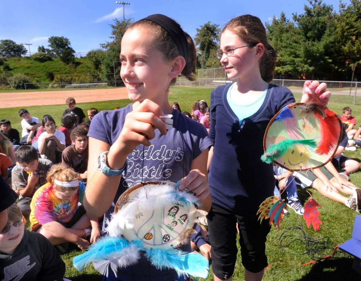 Sixth grade students Katherine DeFazio, left, and Milly Waters, hold dream catchers they made during a Pow Wow in honor of United Nations International Day of Peace at Bethel Middle School on Monday, Sept.21,2009.