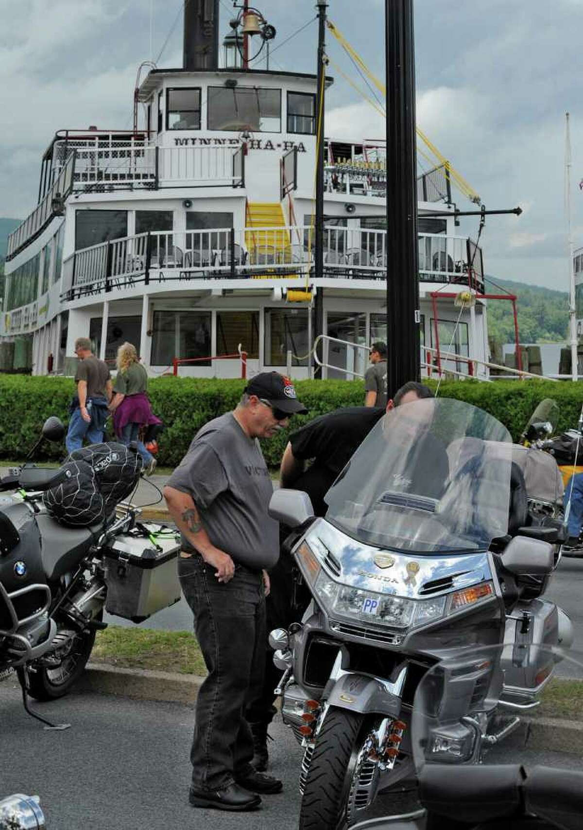 Don Wilcox of Troy, left, and Steve Ray of Argyle enjoy some of the hardware June 10 at Americade in Lake George. 