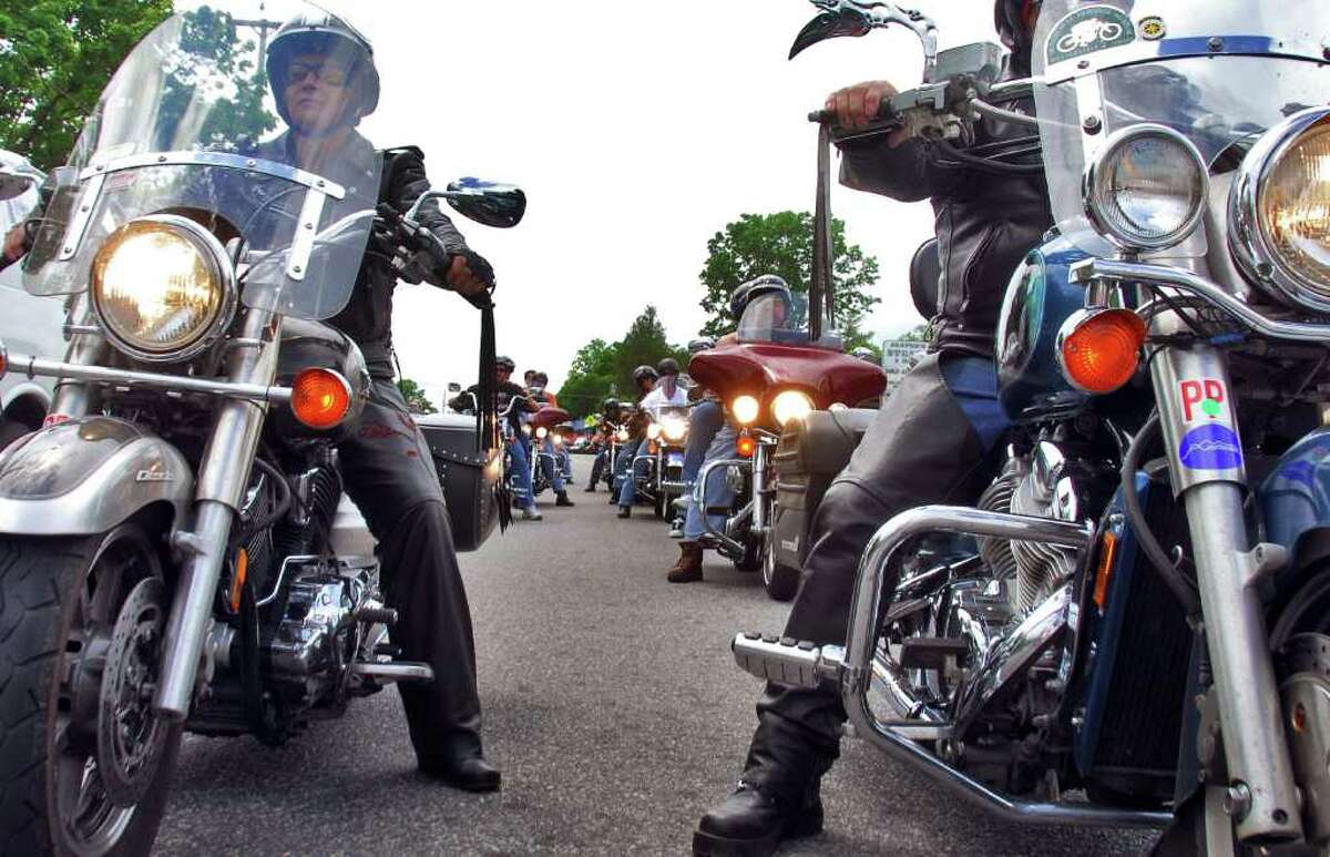 The flash of chrome and the roar of engines mark the return of the annual Americade on June 5, 2008, as thousands of motorcyclists, including this group heading up Canada Street, pour into Lake George Village. 