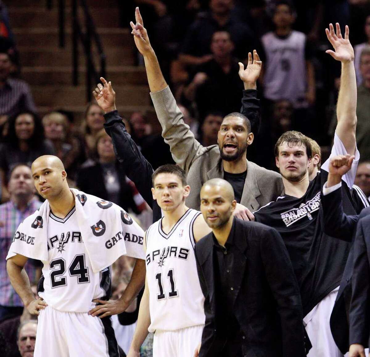 FOR SPORTS - Spurs' Richard Jefferson (from left), Chris Quinn, Tony Parker, Tim Duncan and Tiago Splitter watch second half action from the bench against the Trail Blazers Monday March 28, 2011 at the AT&T Center. The Trail Blazers won 100-92. (PHOTO BY EDWARD A. ORNELAS/eaornelas@express-news.net)