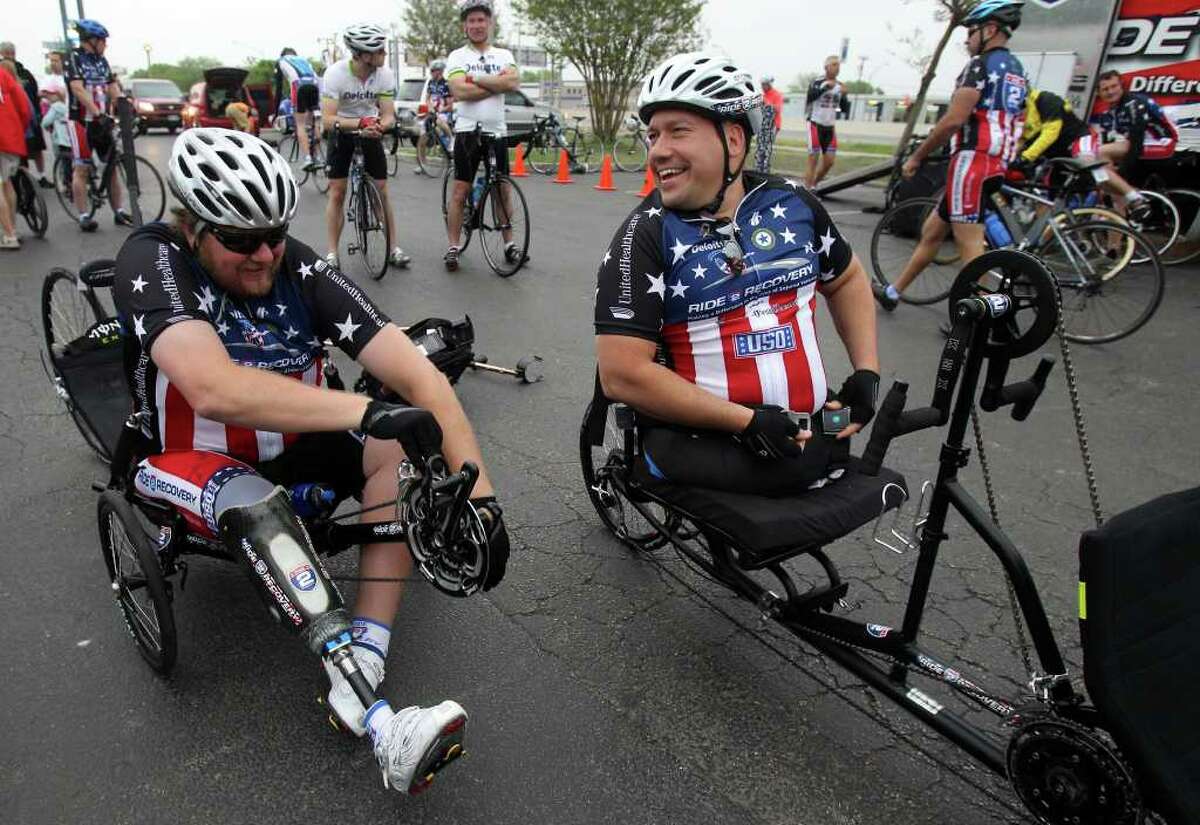 Matt Walker (left) and Chuck Sketch (buckling up) prepare to head for the Center for the Intrepid at Fort Sam Houston on Monday, March 28, 2011, where the Ride 2 Recovery Texas Challenge started. The six-day, 350-mile ride to support rehabilitation for injured veterans began in San Antonio and will end in Arlington on Saturday, April 2. Walker is retired from the Army and Sketch is a former Marine.