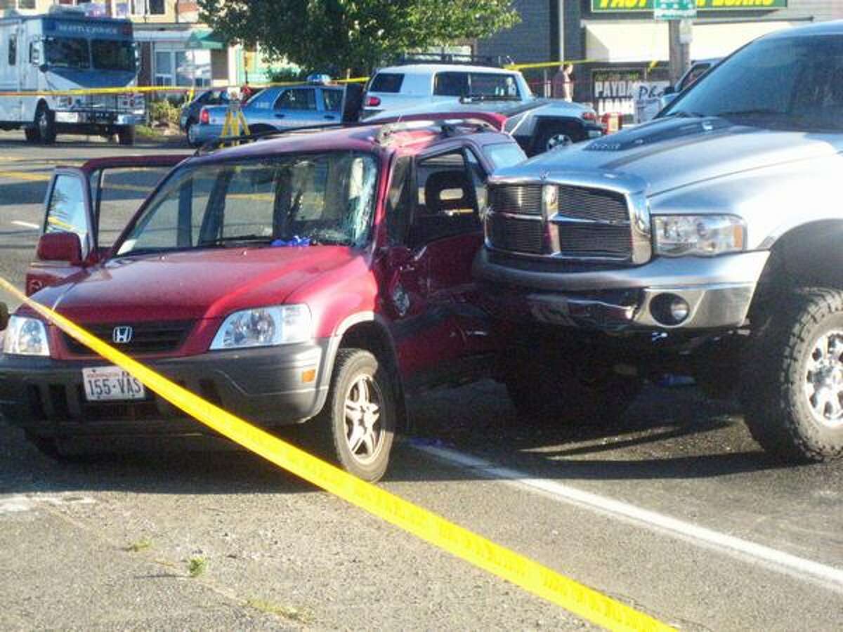 The driver of pickup truck that was reported stolen struck a Honda CRV on Wednesday at the intersection of Greenwood Avenue North and Holman Road North after the driver of the pickup was shot by police.