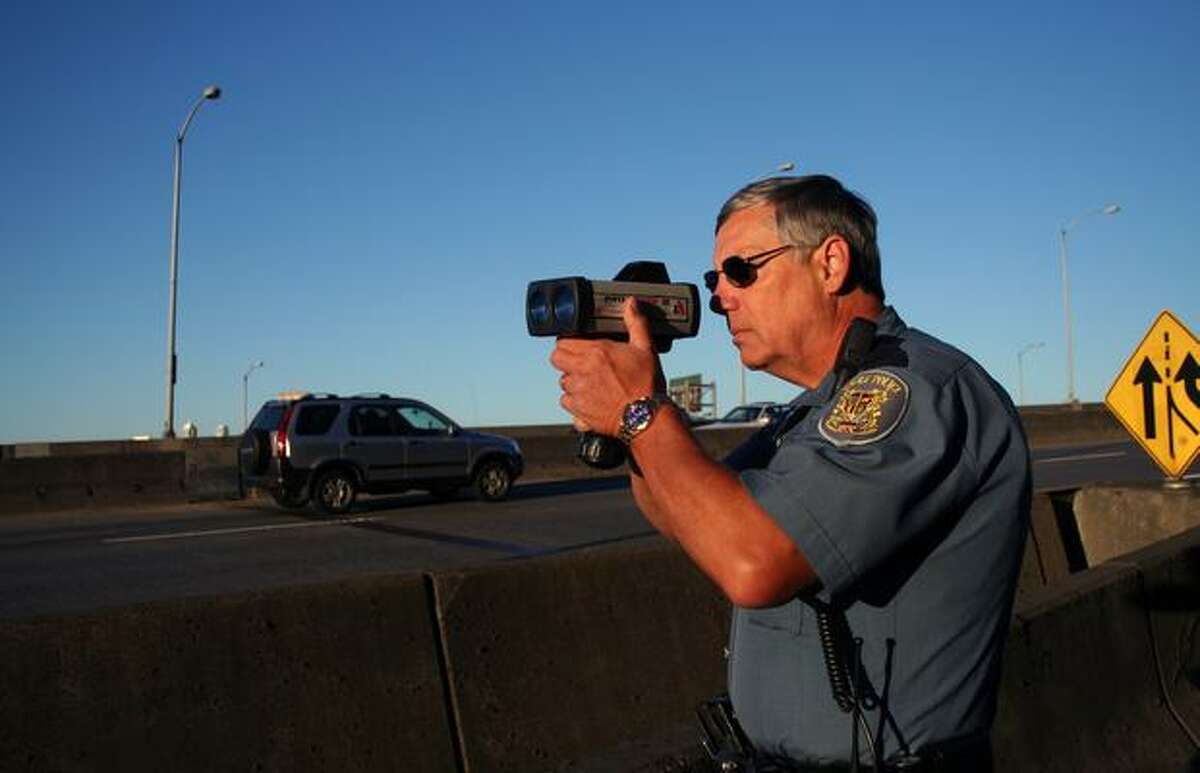 Seattle police officer J. Dean Shirey looks to catch speeders on the West Seattle Bridge.