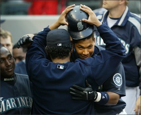 Seattle Mariners pitcher Felix Hernandez is greeted by teammates after he  threw a perfect baseball game against the Tampa Bay Rays, Wednesday, Aug.  15, 2012, in Seattle. (AP Photo/Ted S. Warren Stock