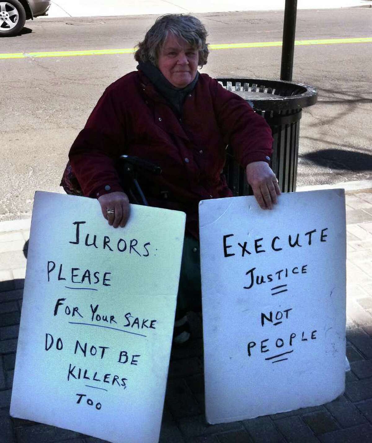 Clare Hogenauer, a retired N.Y. lawyer, protests outside Superior Court in Bridgeport, Conn. March 29th, 2011, where a jury deliberating the sentence of Christopher DiMeo.