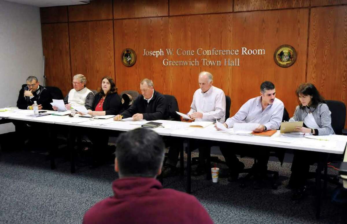 Newly appointed Board of Parks and Recreation member Gary Dell'Abate, 50, of Old Greenwich, second from right, during his first meeting as a board member at Greenwich Town Hall, Wednesday night, March 30, 2011. At right is fellow board member Cathy Weisenburger.