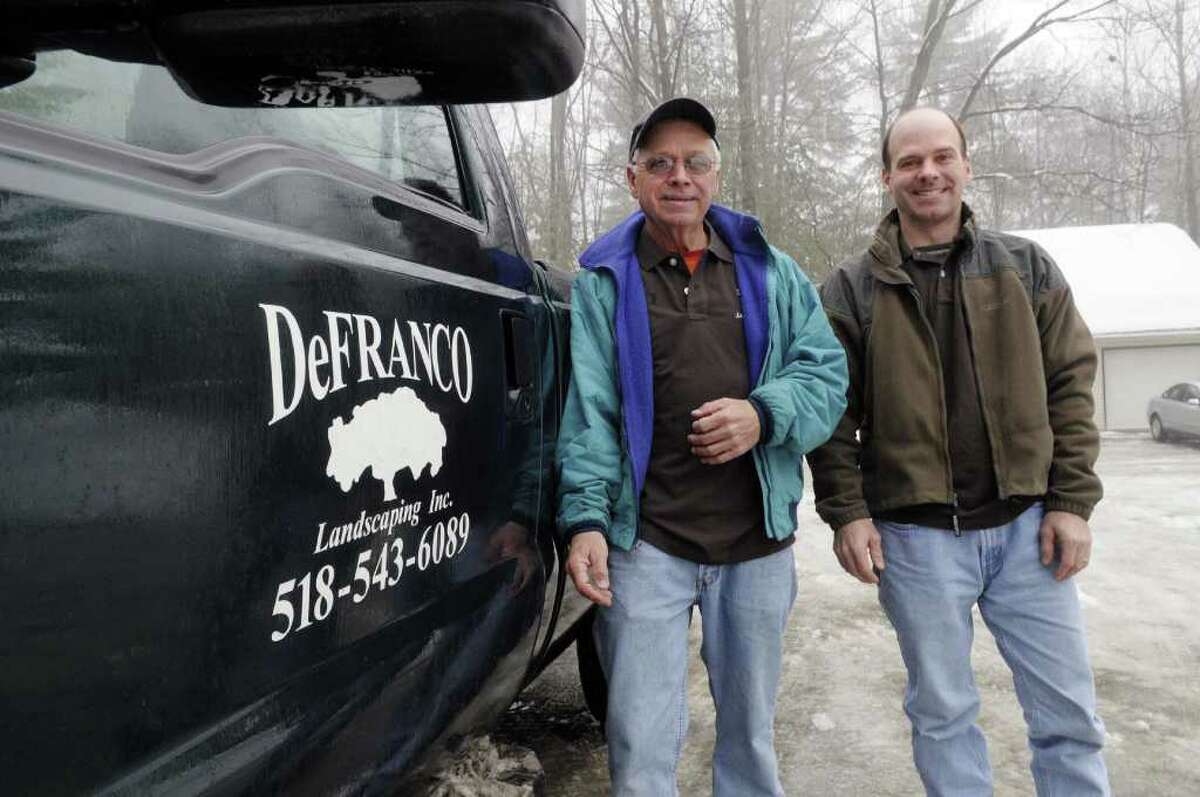 David DeFranco, left, and his son, Tony DeFranco, right, pose outside their business in Hague, NY on Monday, Feb. 28, 2011. The business was honored last year by the Lake George Watershed Coalition for its work on using native plants and landscaping techniques to protect the water quality of the lake. Lake water quality has been declining in recent years as increasing development has increased the amounts of fertilizers, pesticides and other runoff that get into the lake. (Paul Buckowski / Times Union)