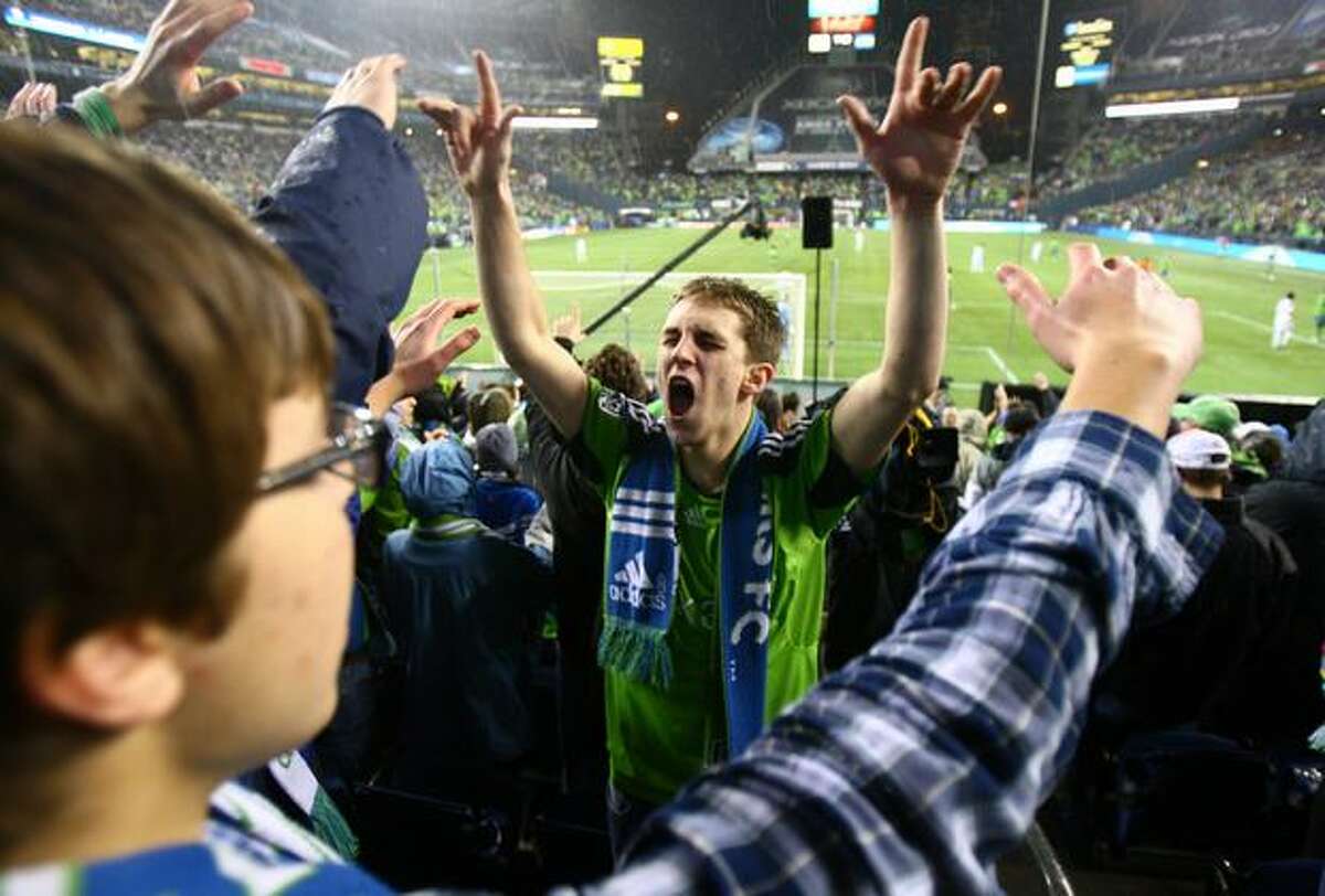 Seattle Sounders fan Lucas McCormick lcheers as the Sounders take on the L.A. Galaxy.