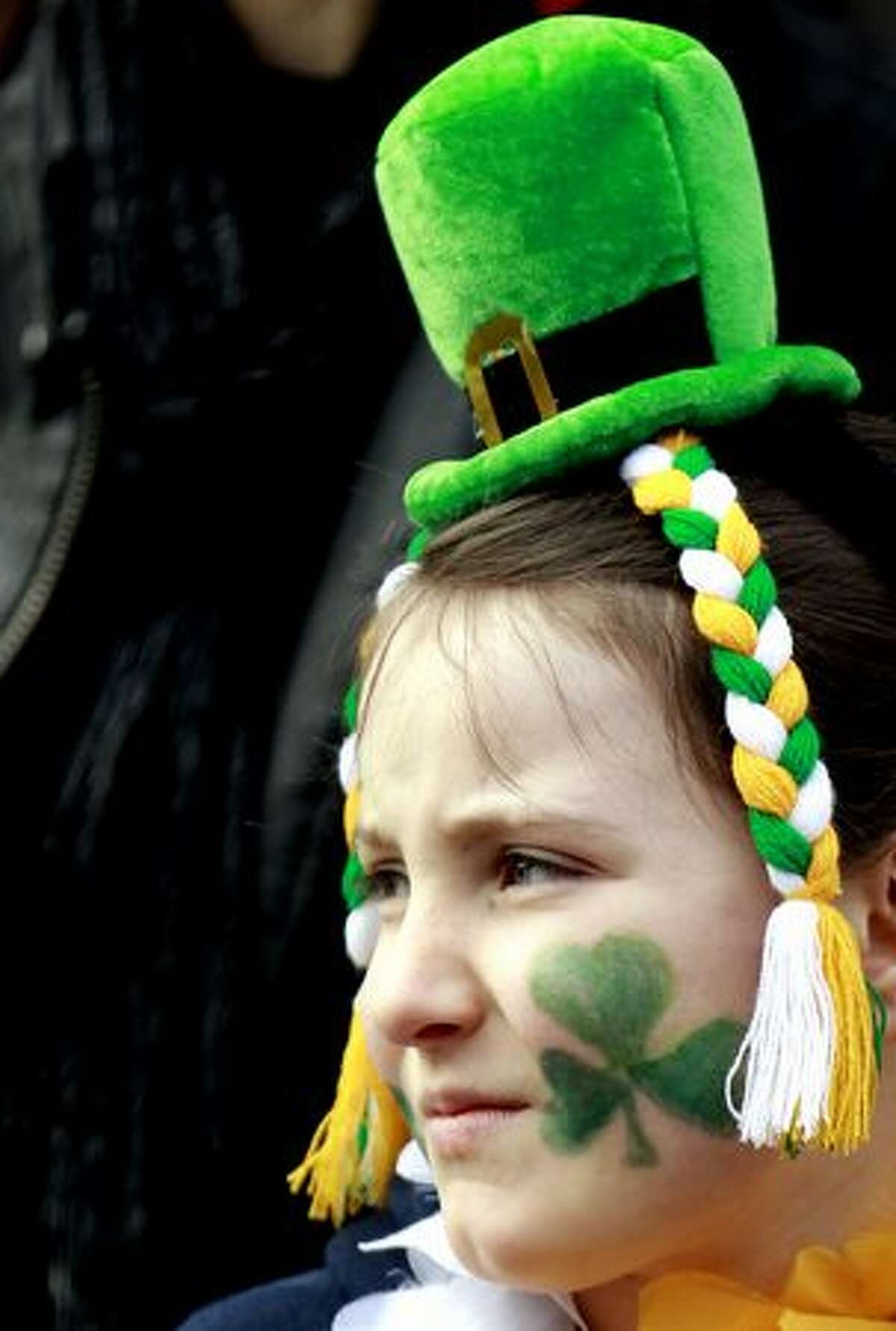 A girl enjoys the St. Patrick's Day celebrations in Belfast, Northern Ireland, Thursday, March, 17, 2011. (AP Photo/Peter Morrison)