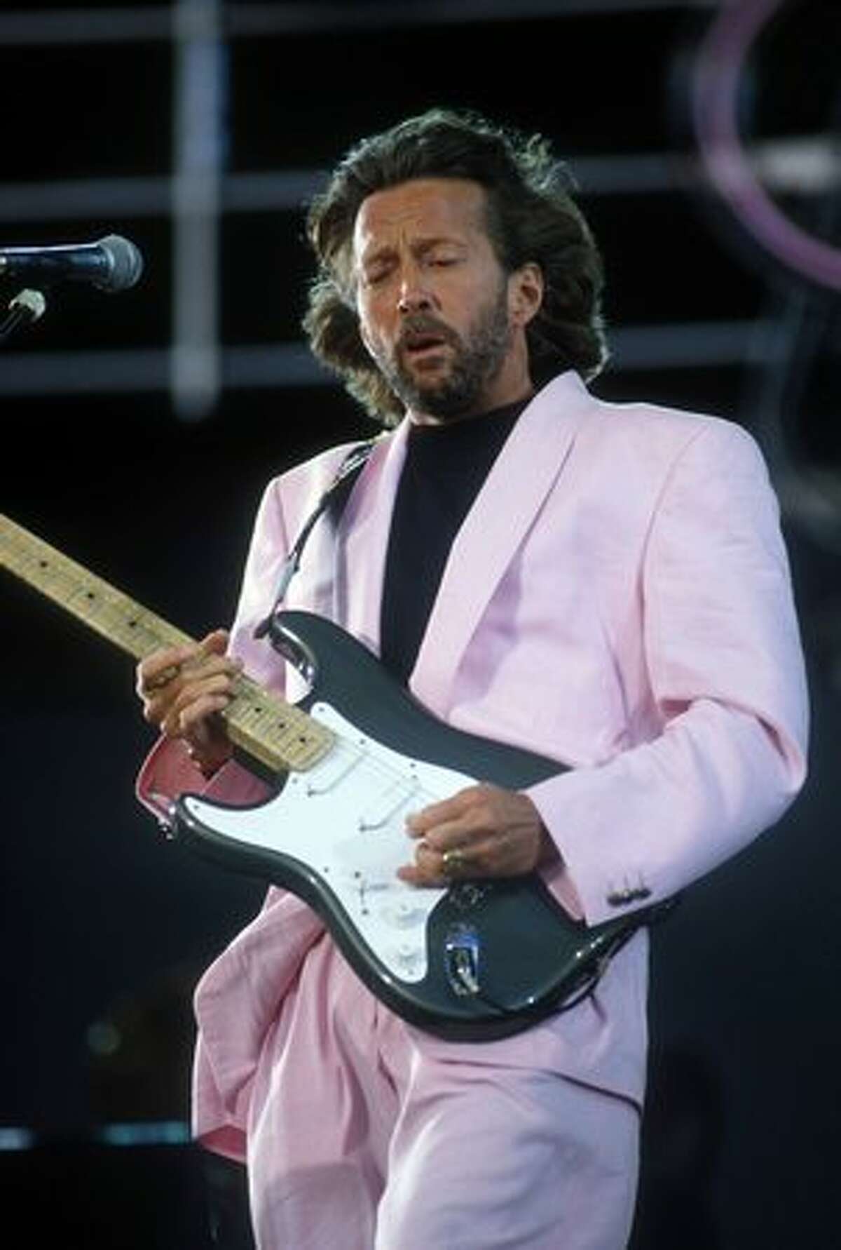 Eric Clapton performing onstage in Knebworth, England, 1990. (Photo by Frank Micelotta/ImageDirect)