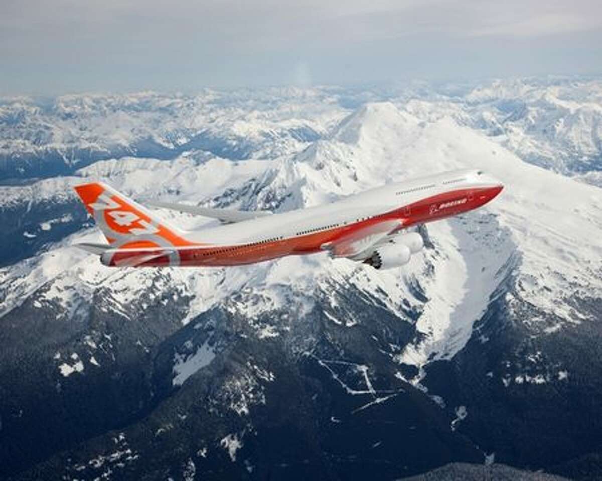 Boeing's first 747-8 Intercontinental flies past Mount Baker.