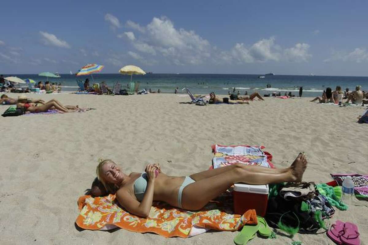 Jenna Serth enjoys the warm weather during spring break at Fort Lauderdale, Fla., Thursday, March 17, 2011. She and a group of friends drove 23 hours from Syracuse, N.Y. to Fort Lauderdale. Spring Break 2011 marks the 50th anniversary of Spring Break as a major cultural event. (AP Photo)