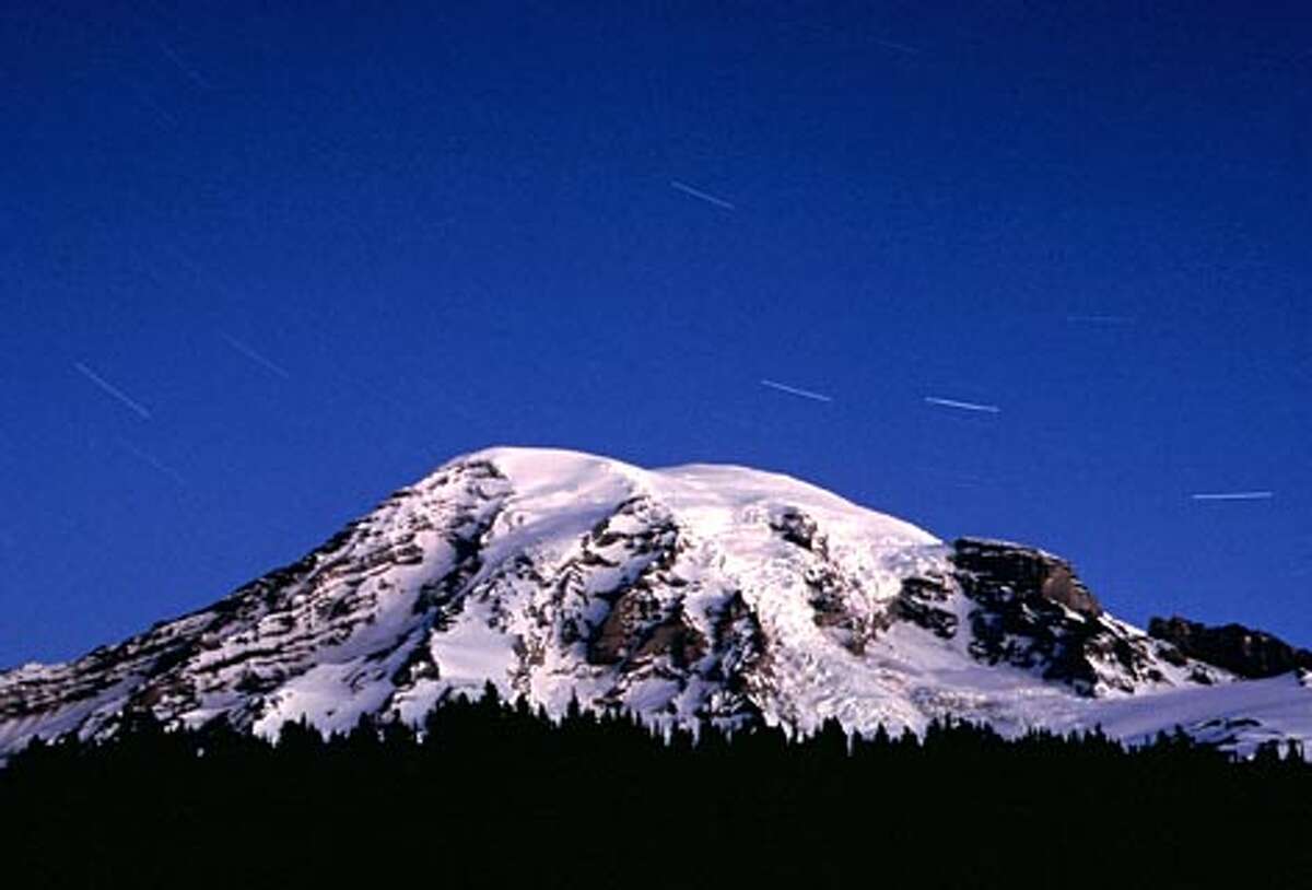 Mt. Rainier in early morning with start trails. (Andrew Nicholls / Seattle P-I file photo)