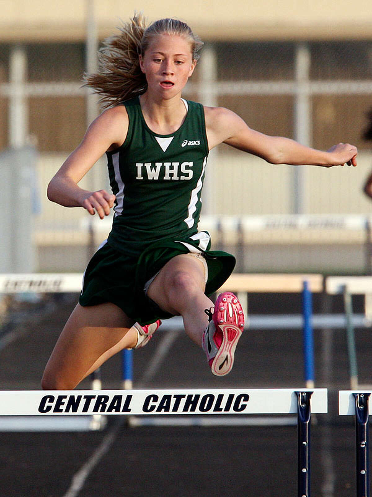 Incarnate Word's Emily Phillips clears the last hurdle in the 300-meter hurdles during the TAPPS 2-5A District Track Meet Thursday March 31, 2011 at Central Catholic High School. Phillips finished in first place.  EDWARD A. ORNELAS/eaornelas@express-news.net)