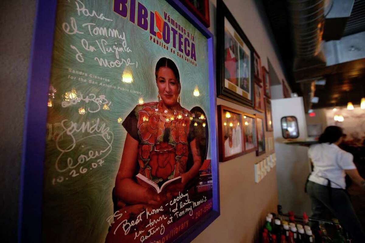 A poster signed by author Sandra Cisneros hangs in Tommy Moore's Cafe & Deli in District 2 on the East Side. New census data shows an increase in the Hispanic population in a district which was once majority African-American.