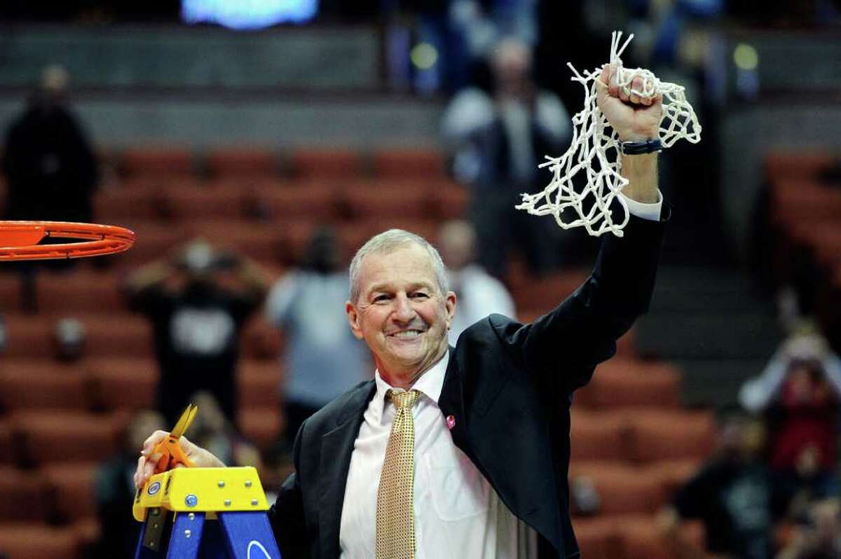 ANAHEIM, CA - MARCH 26: Head coach Jim Calhoun of the Connecticut Huskies cuts down the net after defeatng the Arizona Wildcats to win the west regional final of the 2011 NCAA men's basketball tournament at the Honda Center on March 26, 2011 in Anaheim, California. (Photo by Kevork Djansezian/Getty Images) *** Local Caption *** Jim Calhoun
