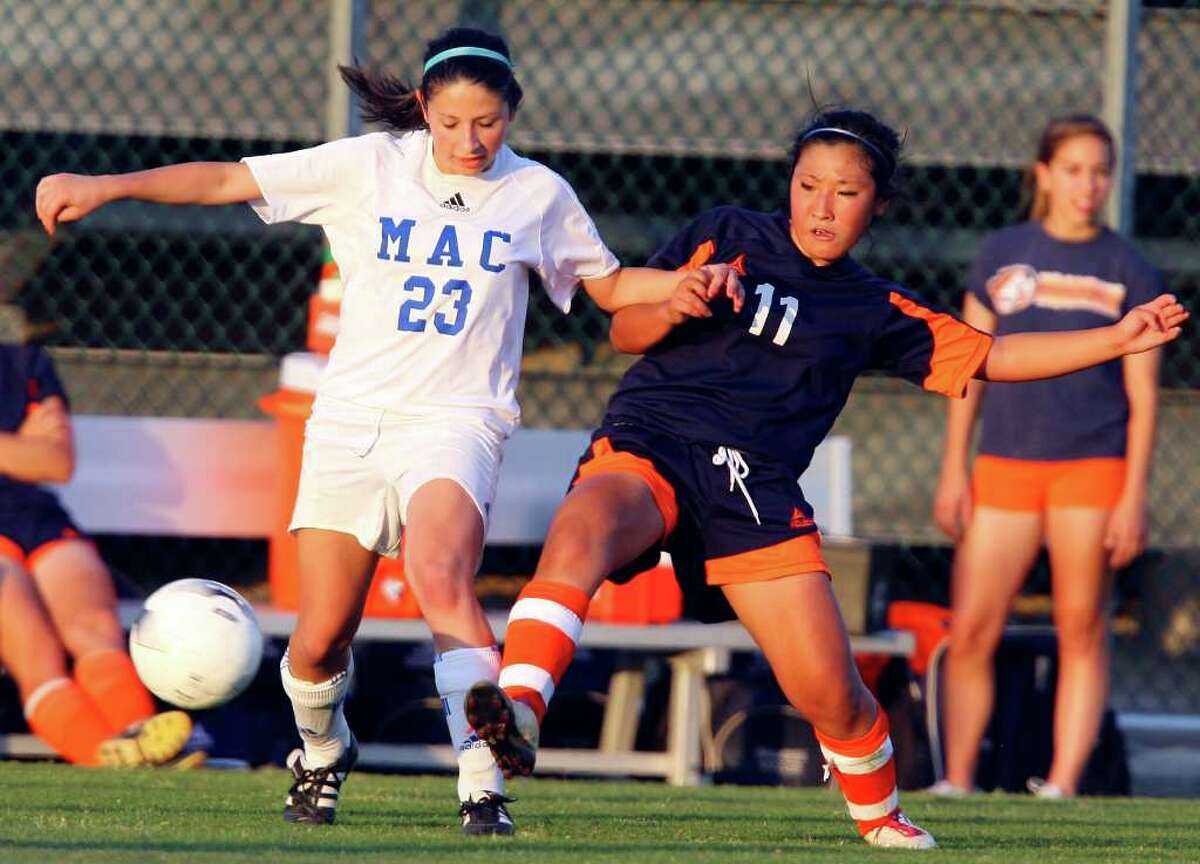 FOR SPORTS - MacArthur's Marissa Allen and Brandeis' Yuri Takano struggle for position on the ball during overtime action Friday April 1, 2011 at Blossom Soccer Stadium. MacArthur won 1-0. (PHOTO BY EDWARD A. ORNELAS/eaornelas@express-news.net)