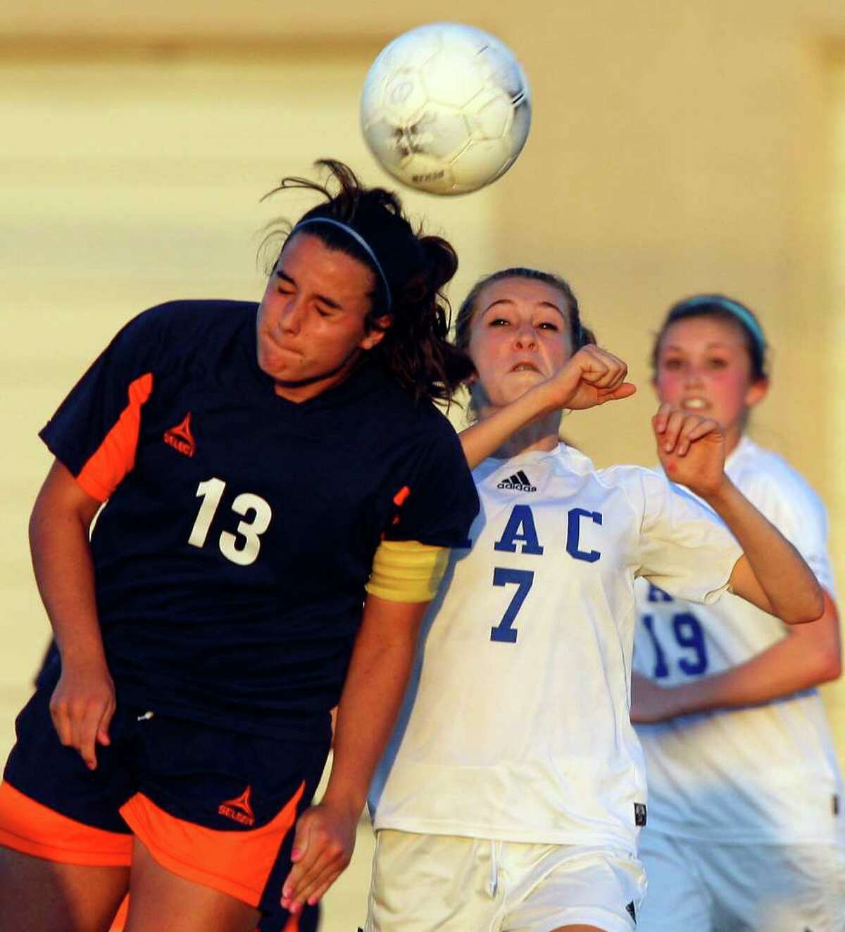 FOR SPORTS - Brandeis' Maddie Harwerth and MacArthur's Brianna Livecchi go up for the ball during overtime action Friday April 1, 2011 at Blossom Soccer Stadium. MacArthur won 1-0. (PHOTO BY EDWARD A. ORNELAS/eaornelas@express-news.net)