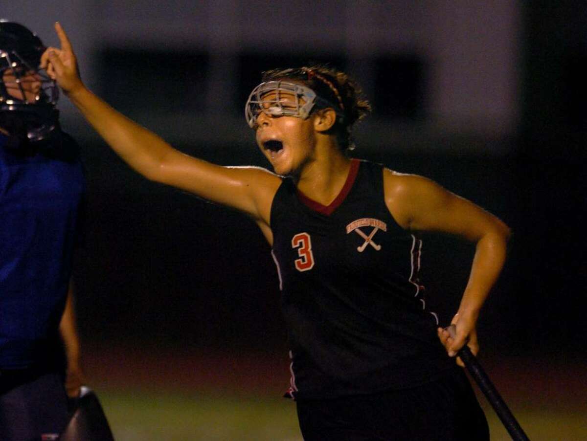 Fairfield Warde's Christie Zierolf reacts after scoring the game winning shot in overtime during Tuesday night's field hockey match against Ludlowe.