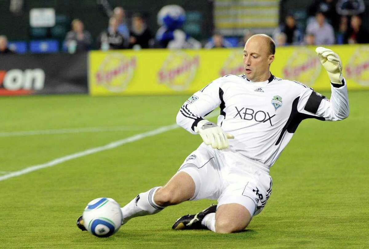 Kasey Keller of the Seattle Sounders FC slides to kick the ball away from his goal against the San Jose Earthquakes during an MLS soccer game at Buck Shaw Stadium in Santa Clara, Calif., on Saturday, April 2, 2011. (Photo by Thearon W. Henderson/Getty Images)