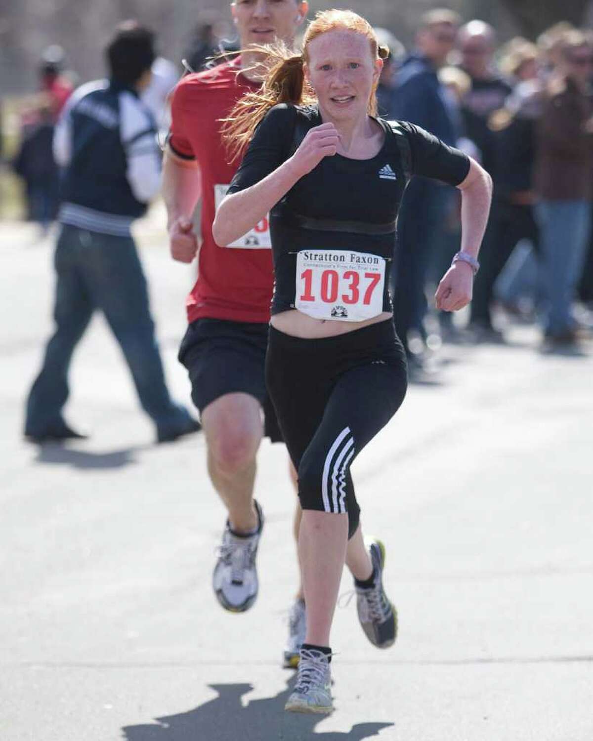 New Fairfield Middle School student Sabrina Rautter, 14, wins the women's division of the Stratton Faxon Danbury 5K Sunday in Rogers Park.