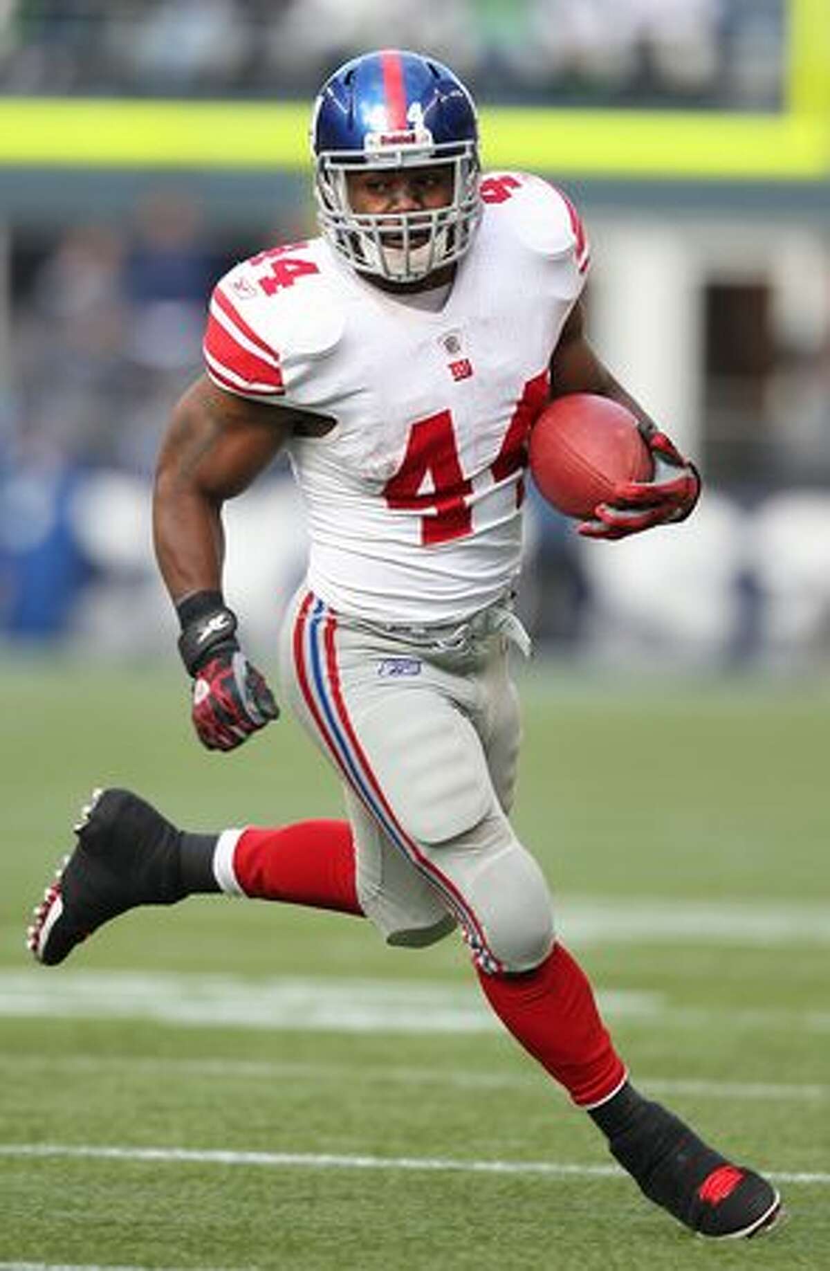 Running back Ahmad Bradshaw #44 of the New York Giants rushes against the Seattle Seahawks.