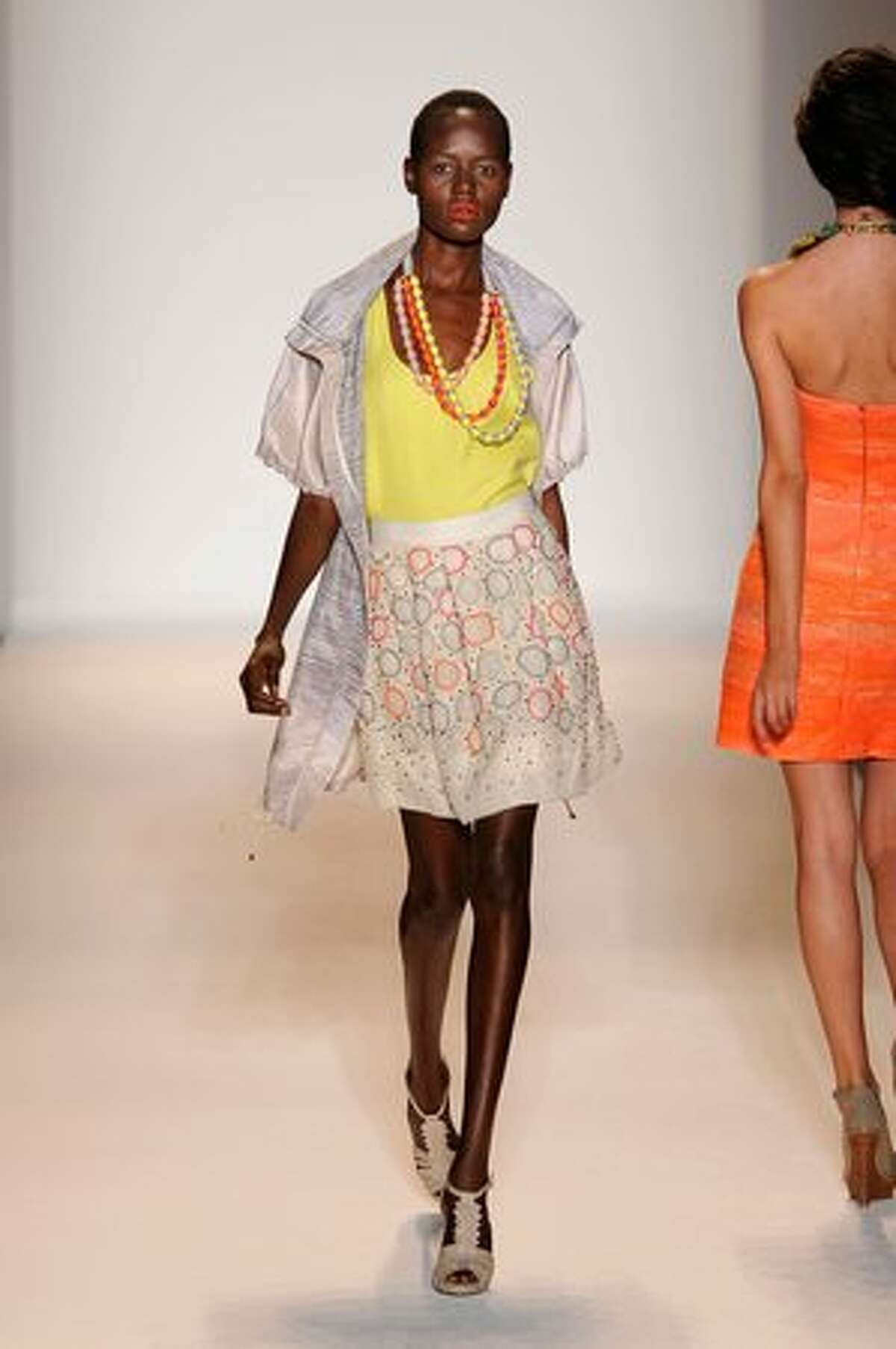 A model walks the runway at the Lela Rose spring 2011 fashion show.