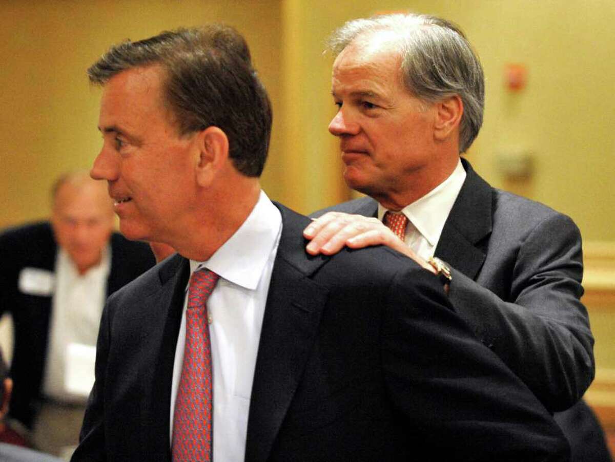Gubernatorial candidate Ned Lamont, left, is greeted by fellow candidate Tom Foley in Stamford on June 29, 2010. (AP Photo/Douglas Healey)