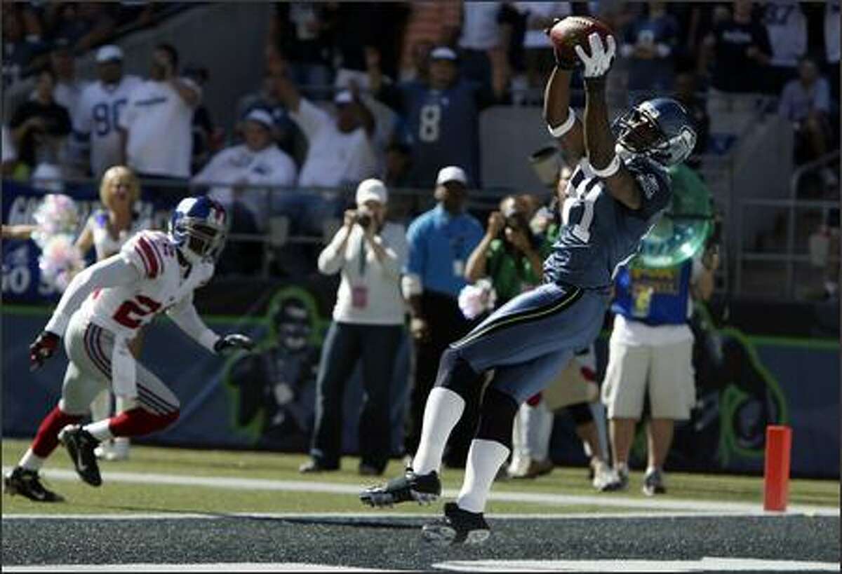 Seattle Seahawks Nate Burleson scores against the New York Giants during the first quarter.