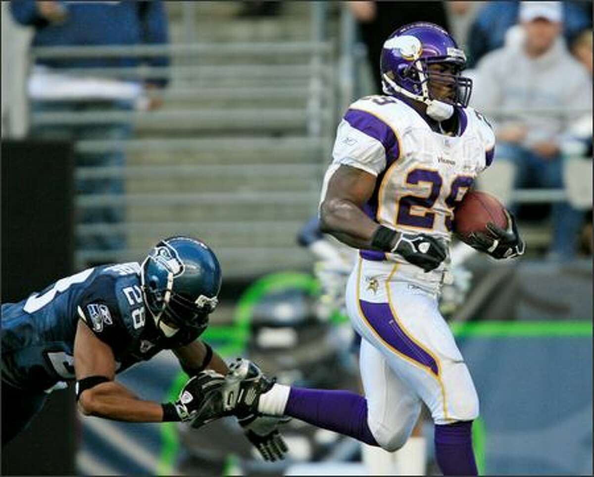 Vikings running back Chester Taylor eludes a last-ditch dive by safety Peter Boulware on the way to a 95-yard score, the longest-ever run by a Seattle opponent.