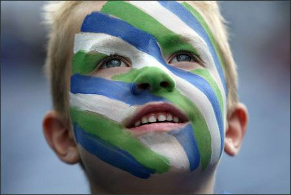 Seattle Seahawks fan Bryce Porter, 6, from Puyallup, has his game face on as he gazes in awe at the stadium as the Hawks prepare to face the Minnesota Vikings at Qwest Field in Seattle, Wash., Saturday August 24, 2007.