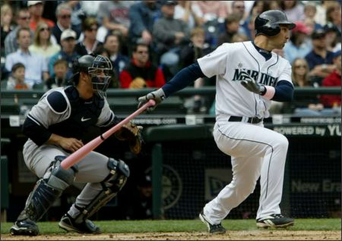 Seattle Mariners' Raul Ibanez connects for a RBI single to score Ichiro Suzuki against the New York Yankees' Andy Pettitte during the 3rd inning.