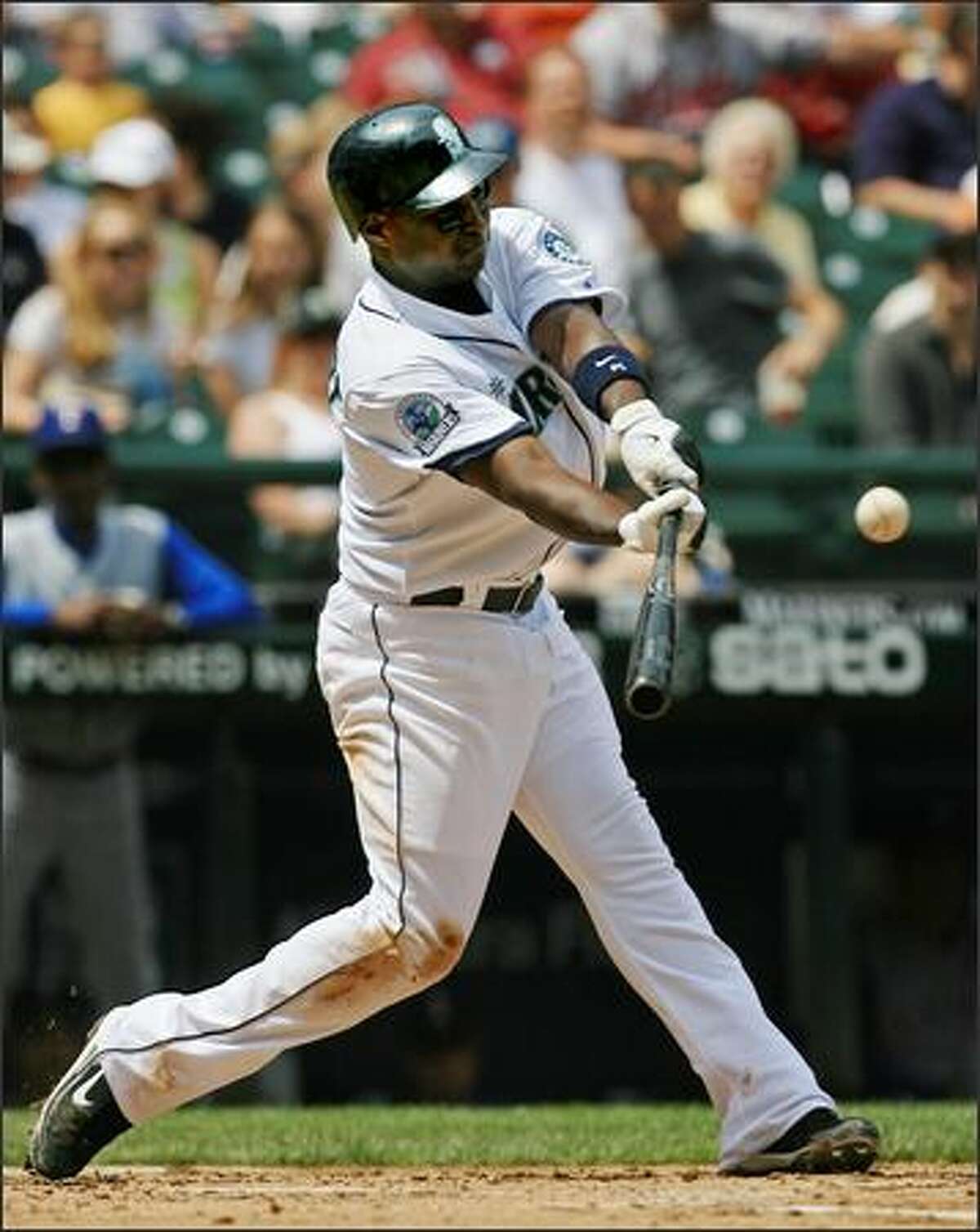 Seattle Mariners' Yuniesky Betancourt doubles off Texas Rangers starter Robinson Tejeda to extend his hitting streak to 15 games during the 2nd inning.