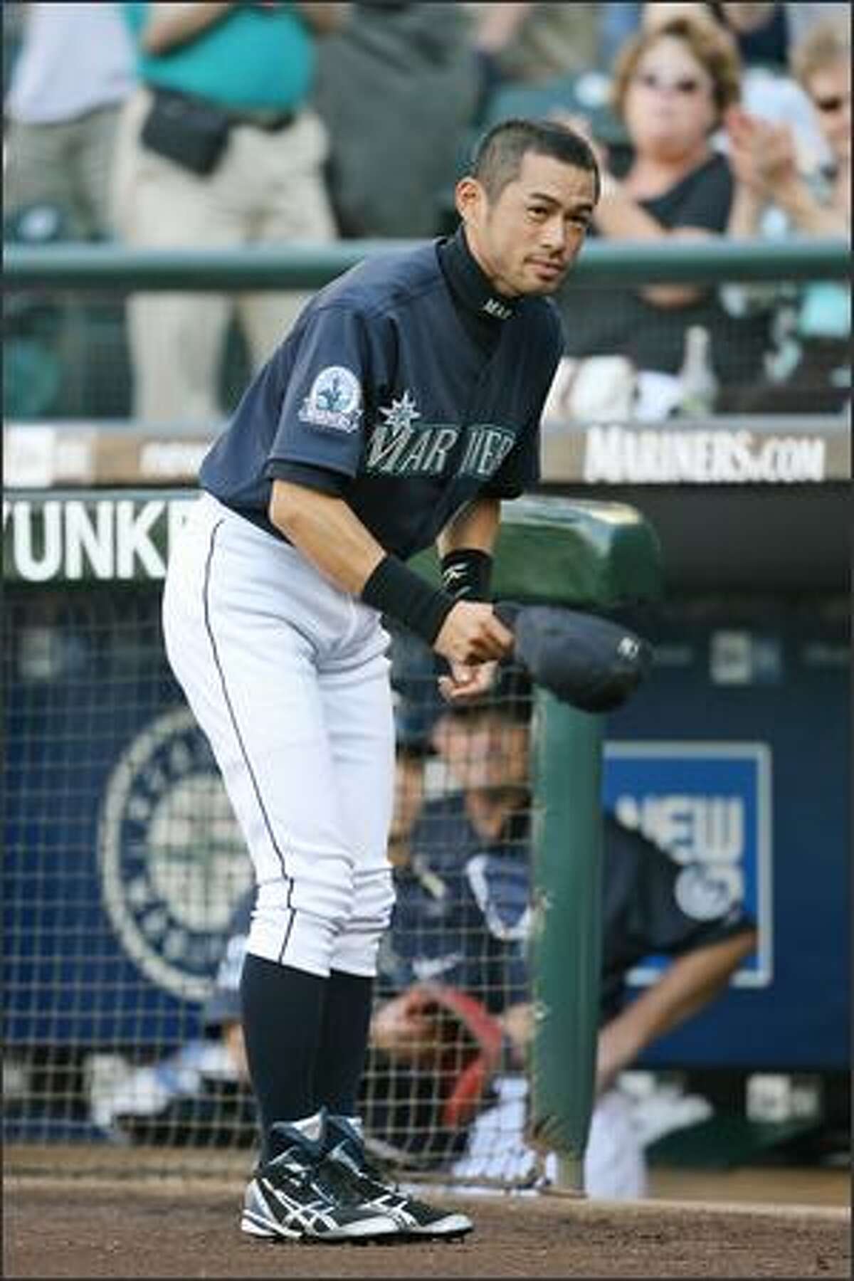 Seattle Mariner Ichiro Suzuki bows to his fans prior to a game against the Detroit Tigers at Safeco Field on Friday. Suzuki signed a five-year contract extension worth an estimated $100 million.