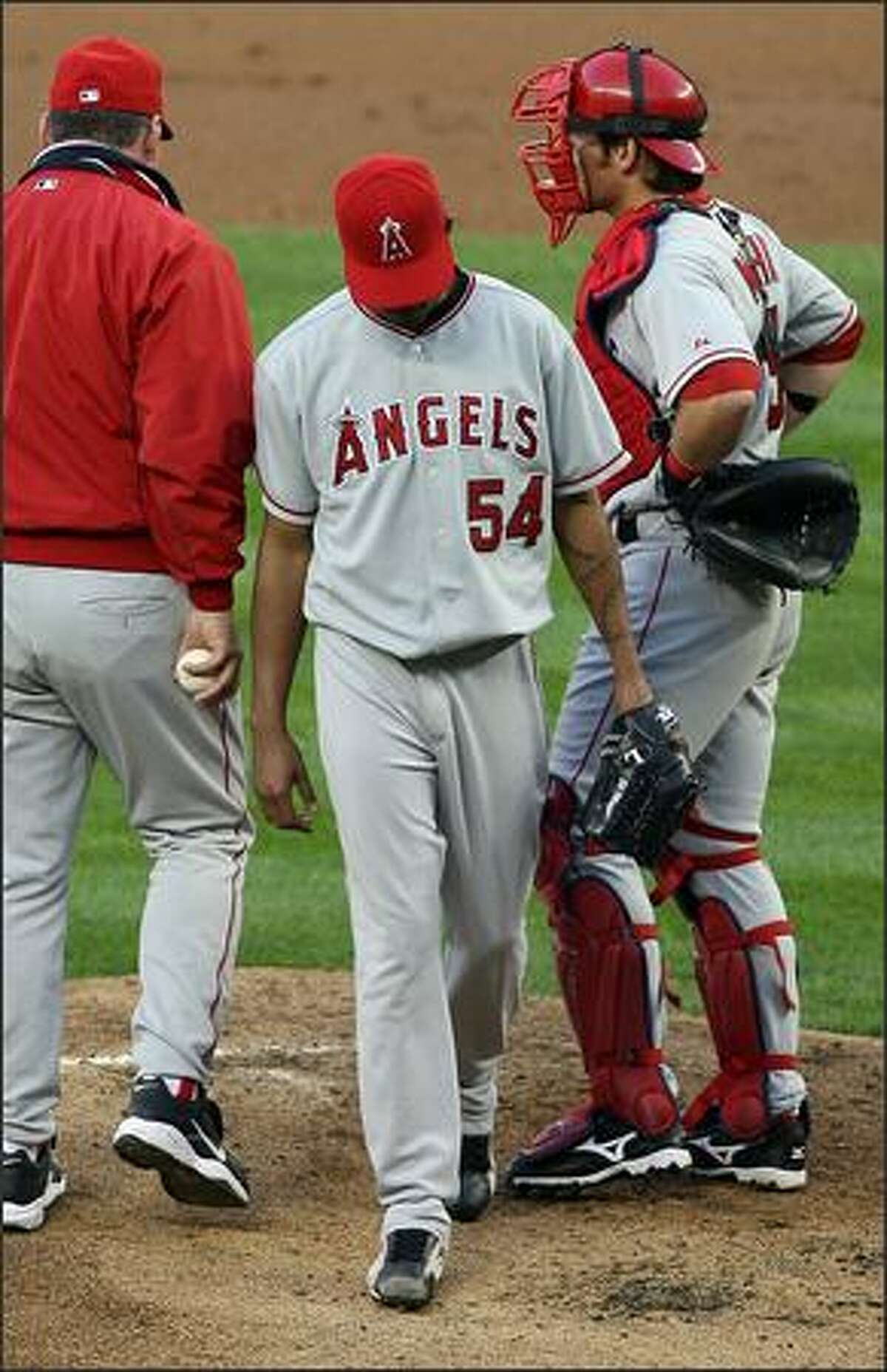 Los Angeles Angels Ervin Santana is pulled form the game by Manager Mike Scioscia after giving up five runs to the Seattle Mariners during first inning action at Safeco Field in Seattle, Wash., Tuesday August 28, 2007.