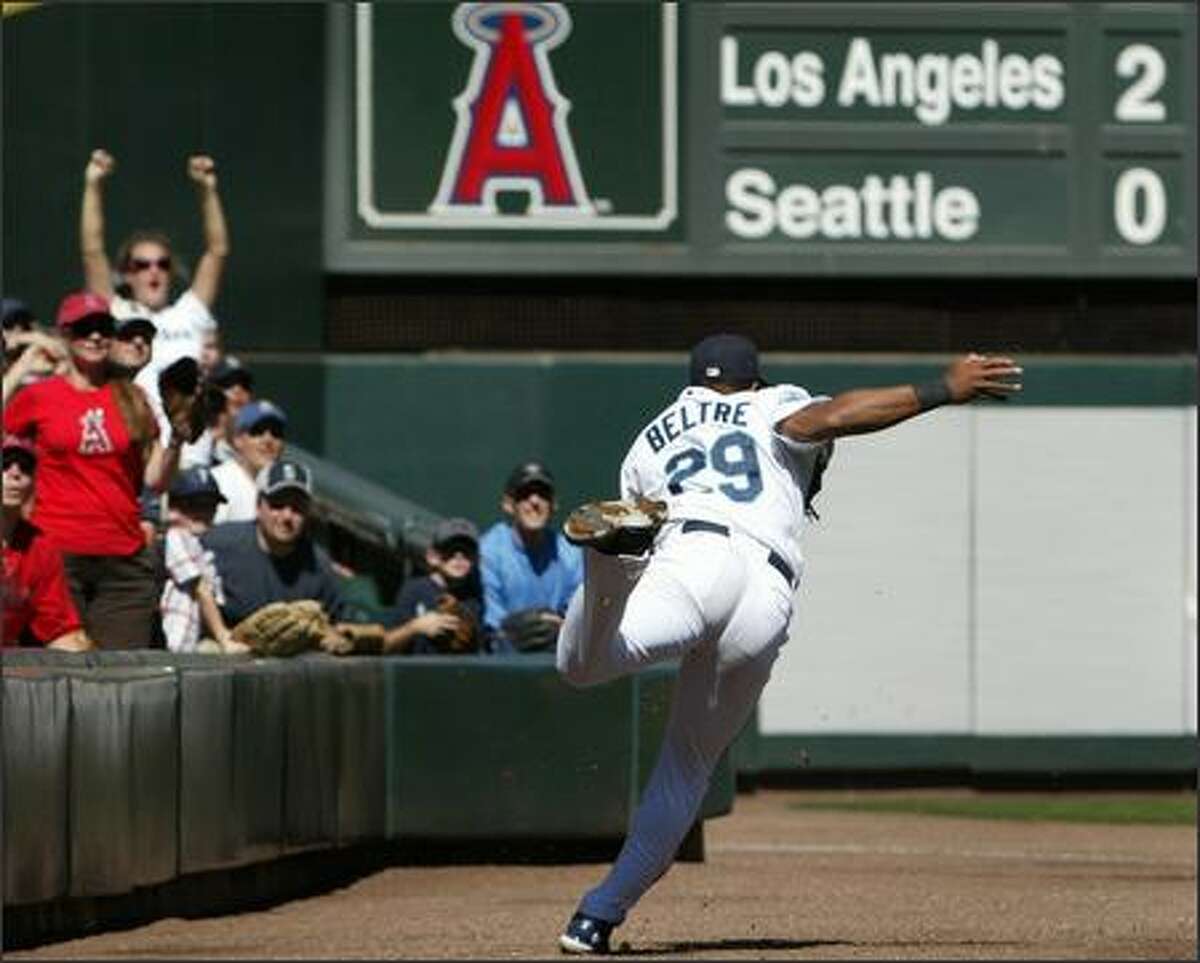 Seattle Mariner Adrian Beltre makes a catch of a foul ball hit by Los Angeles Angels Casey Kotchman in the second inning as the mariners trailed the Angles on Wednesday, August 29, 2007 at Safeco Field in Seattle.