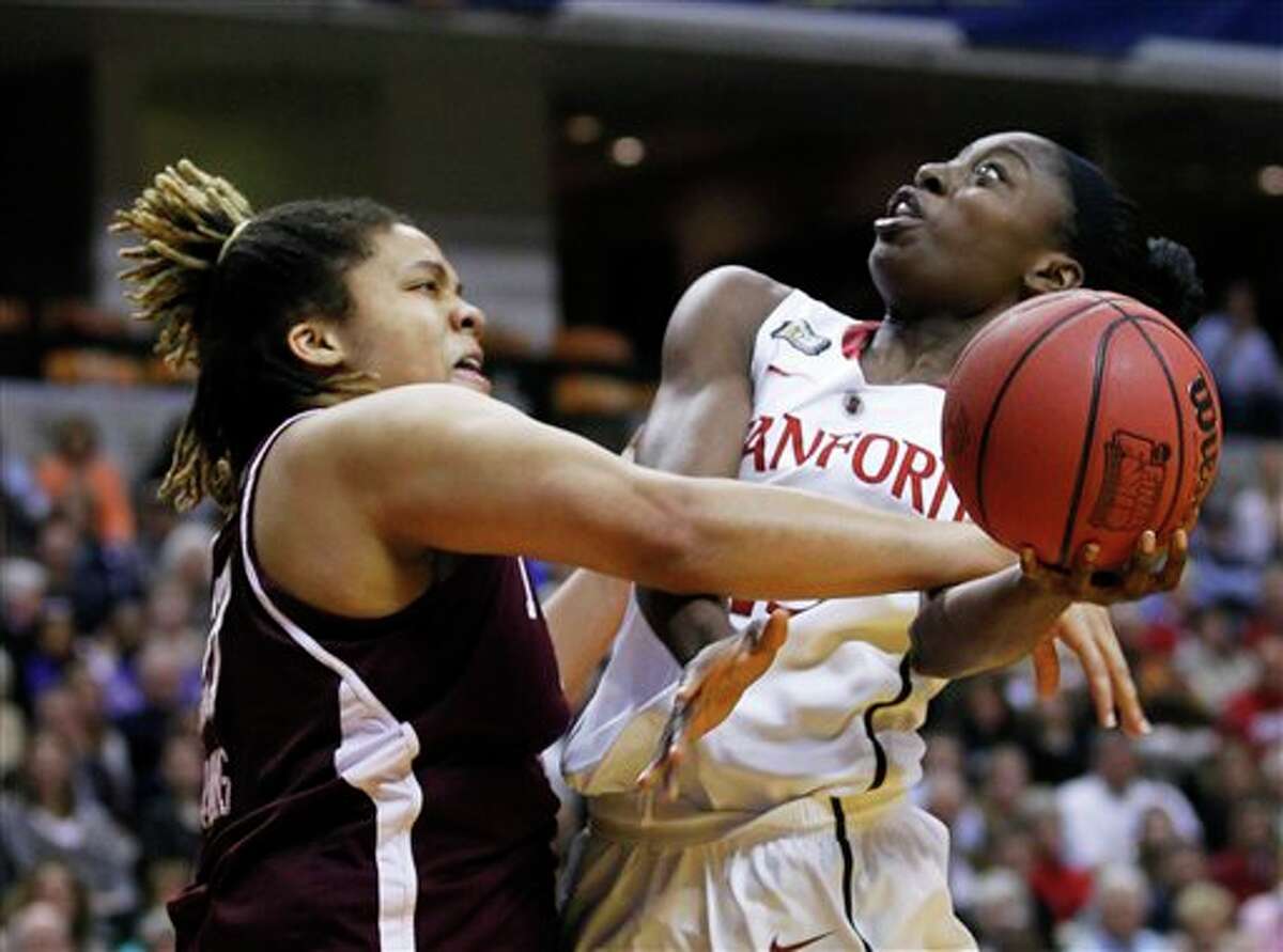 Stanford's Chiney Ogwumike, right, puts up a shot under pressure from Texas A&M's Danielle Adams in the first half of a women's NCAA Final Four semifinal college basketball game in Indianapolis, Sunday, April 3, 2011.