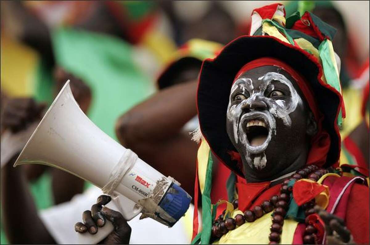 Guinea's soccer fan during their Africa Cup of Nations group A soccer match against Namibia in Sekondi, Ghana. AP Photo/Themba Hadebe