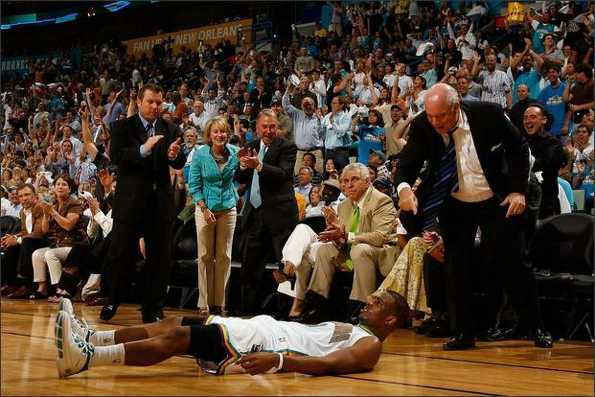 Chris Paul #3 of the New Orleans Hornets lies on the ground after being fouled during the game against the Dallas Mavericks in Game One of the Western Conference Quarterfinals during the 2008 NBA Playoffs at The New Orleans Arena in New Orleans, Louisiana. The Hornets defeated the Mavericks 127-103. (Photo by Chris Graythen/Getty Images)